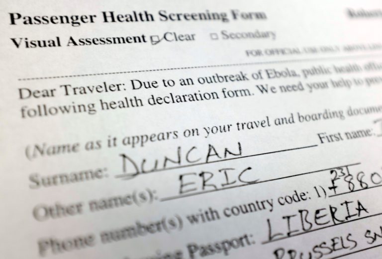 This Oct. 2, 2014 photo shows a copy of a passenger health screening form filled out by Ebola patient Thomas Eric Duncan. (AP/Kiichiro Sato)