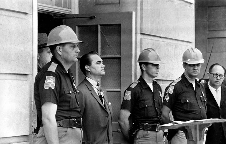 In June 11, 1963, Democratic Gov. George Wallace blocks the entrance to the University of Alabama as he turned back a federal officer attempting to enroll two black students at the university campus in Tuscaloosa, Ala. (AP Photo)