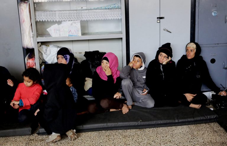 Women sit on the floor of a school at Yarmouk refugee camp in Damascus, Syria, Sunday, April 12, 2015. (AP Photo)Â 