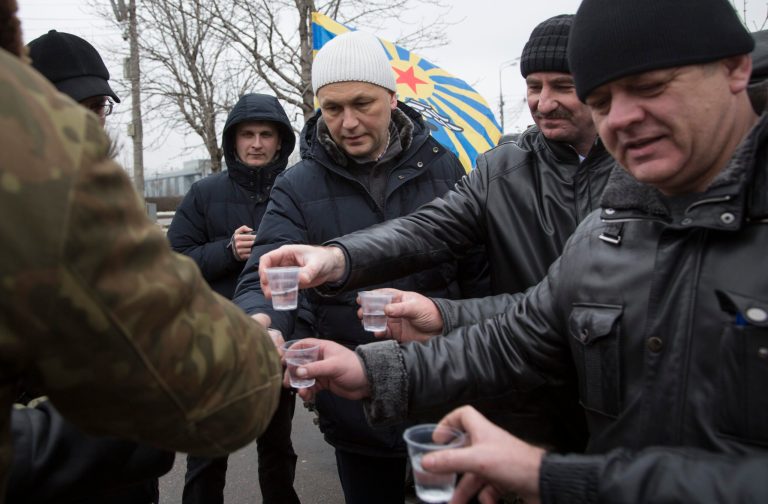 Russian Afghan war veterans who took part in the Soviet war in Afghanistan, toast while marking the 25th anniversary of the end of war in Afghanistan,  in Moscow, Russia, Saturday, Feb. 15, 2014. Russian Defense Minister Sergei Shoigu said in a statement marking Saturday's anniversary that Soviet soldiers' heroism in the war was part 