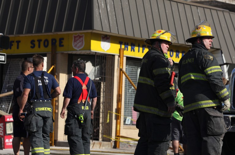 Emergency personnel respond to a building collapse on the edge of downtown Philadelphia on Wednesday, June 5, 2013. A building that was being torn down collapsed with a thunderous boom, raining bricks on a neighboring thrift store, killing a woman and injuring at least 13 other people in an accident that witnesses said was bound to happen. (AP Photo/Philadelphia Inquirer, Andrew Renneisen) PHIX OUT; TV OUT; MAGS OUT; NEWARK OUT MAGS OUT;