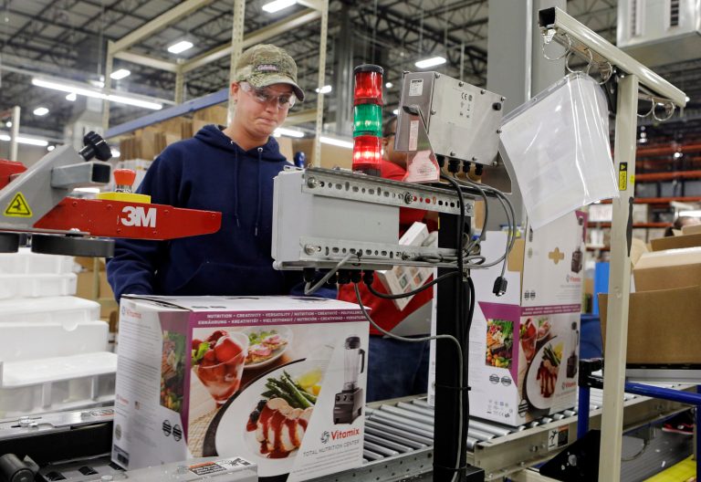 In this April 15, 2014 photo, completed blenders roll off the packaging line at the Vitamix manufacturing facility in Strongsville, Ohio. The Commerce Department reports on wholesale trade inventories for March on Friday, May 9, 2014. (AP Photo/Mark Duncan)