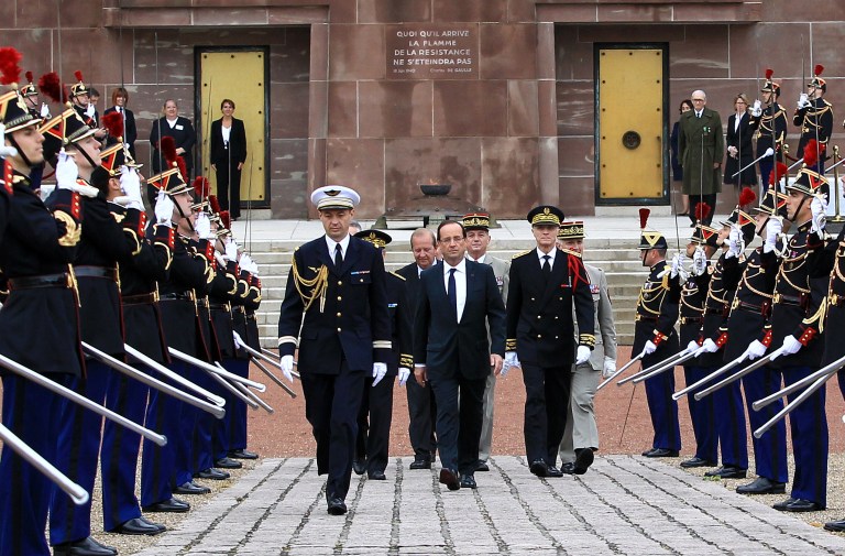   French President Francois Hollande attends a ceremony to mark the 72nd anniversary of Gen. Charles de Gaulle's appeal of June 18, 1940, at the Mont Valerien memorial in Suresnes, outside of Paris, Monday, June 18, 2012. The appeal, which was delivered on the BBC by Charles de Gaulle, served to rally his countrymen after the fall of France to Nazi Germany. (AP Photo/Bob Edme, Pool)  