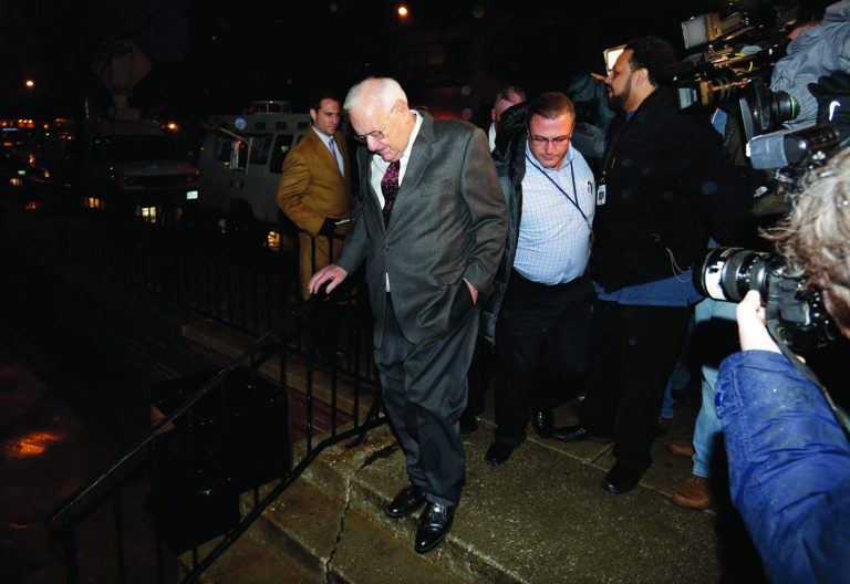 Former Illinois Gov. George Ryan, center, arrives at a halfway house in Chicago Wednesday, Jan. 30, 2013, after serving five-plus years in federal prison on corruption charges. The 78-year-old Ryan began serving his 6 1/2-year sentence in November 2007 in Oxford, Wis., and was released from another prison in Terra Haute, Ind., to enter the halfway house under a work-release program. (AP Photo/M. Spencer Green)