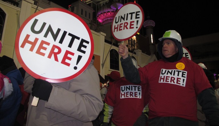 This 2014 photo shows members of the Unite Here casino workers union marching in front of the Trump Taj Mahal casino in Atlantic City, N.J. In a Wednesday interview with the Washington Examiner, Unite Here President D. Taylor says he will cut off support to Democrats who support a bill that will allow tribes to keep unions from forming on their lands. (AP Photo/Wayne Parry)