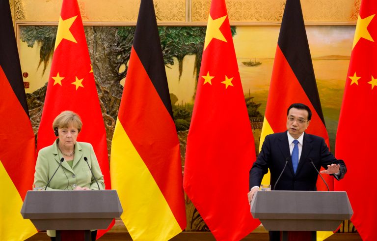 German Chancellor Angela Merkel looks as Chinese Premier Li Keqiang speaks during a joint news conference at the Great Hall of the People in Beijing, China Monday. (AP/Andy Wong)