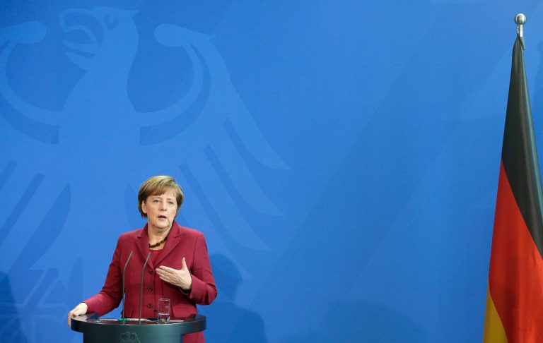 German Chancellor Angela Merkel speaks during a joint press conference with the Prime Minister of Canada Stephen Harper, as part of a meeting at the chancellery in Berlin, Germany, Thursday, March 27, 2014. (AP Photo/Michael Sohn)