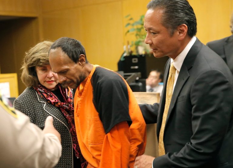 Juan Francisco Lopez- Sanchez, center, is lead out of the courtroom by San Francisco Public Defender Jeff Adachi, right, and Assistant District Attorney Diana Garciaor, left, after his arraignment on Tuesday, July 7, 2015. (AP Photo)Â 