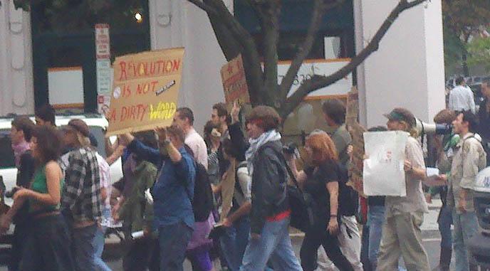 D.C. police watch protestors march down K Street