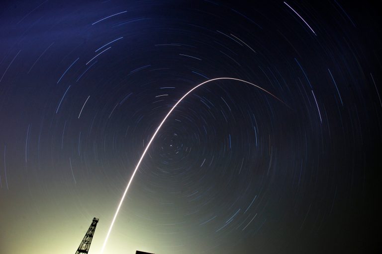 The Soyuz-FG rocket booster with Soyuz TMA-13M space ship carrying a new crew to the International Space Station, ISS, flies in the sky at the Russian leased Baikonur cosmodrome, Kazakhstan, Thursday, May 29, 2014. Circular star tracks around the Polar Star and track of the rocket a the result of the long time exposure. (AP Photo/Dmitry Lovetsky)