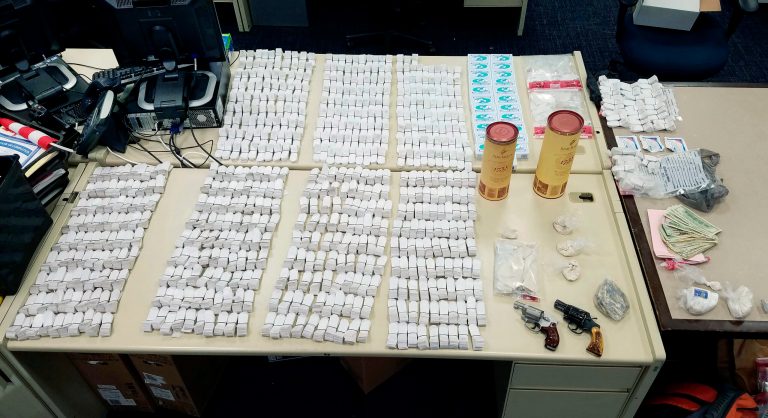 Items seized in a drug raid in the Asylum Hill neighborhood in Hartford, Conn. Hartford Police Department Deputy Chief Brian Foley said multiple officers became ill when they were exposed to heroin and fentanyl during the bust. (Hartford Police Department via AP)