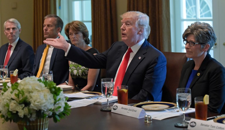 President Donald Trump speaks before having lunch with Republican Senators in the Cabinet Room of the White House in Washington, Tuesday, June 13, 2017. From left are Sen. Rob Portman, R-Ohio, Sen. John Thune, R-S.D., Sen. Lisa Murkowski, R-Alaska, the president and Sen. Joni Ernst, R-Iowa. (AP Photo/Susan Walsh)