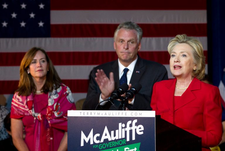 Former Secretary of State Hillary Rodham Clinton speaks in support of Virginia gubernatorial candidate Terry McAuliffe during a campaign rally Women for Terry, at the State Theater in Falls Church, Va. on Saturday, Oct. 19, 2013. With them McAuliffe wife's Dorothy. ( AP Photo/Jose Luis Magana)