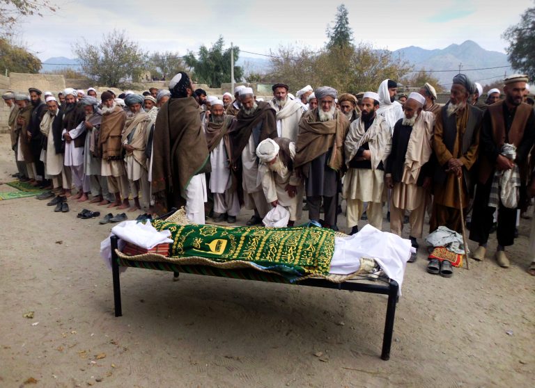   Afghan relatives and villagers prepare to offer funeral prayers over the body of Najia Sediqi, Laghman's head of the women's affairs department in Laghman, east of Kabul, Afghanistan, Monday, Dec. 10, 2012. Gunmen shot and killed the head of the women's affairs department for the eastern Laghman province, said Sarhadi Zewak, a spokesman for the provincial government. (AP Photo/Khalid Khan)  
