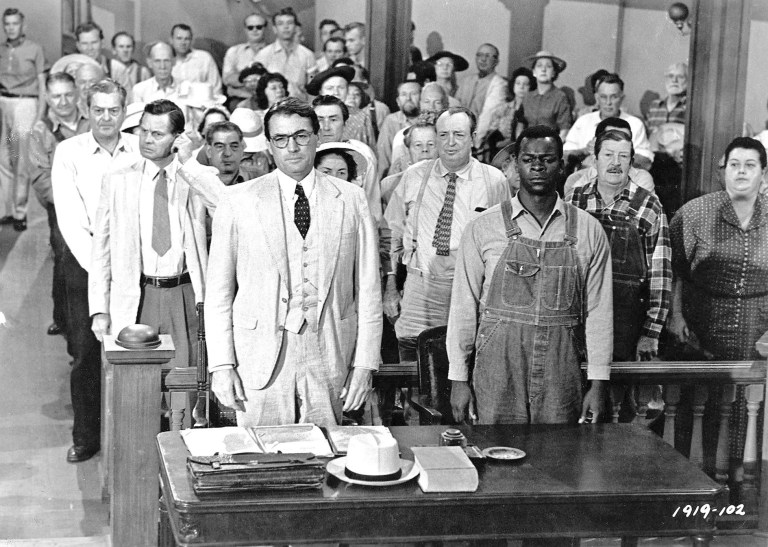 This picture provided by Universal Studios Home Entertainment shows actors Gregory Peck, foreground left, and Brock Peters, foreground right, in a scene from the 1962 film 
