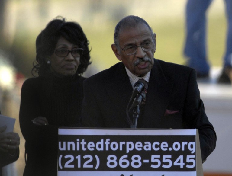 Rep. John Conyers, D-Mich., right, speaks during a rally opposing the war in Iraq as Rep. Maxine Waters, D-Calif., listens on the National Mall Saturday, Jan. 27, 2007 in Washington. (AP Photo/Kevin Wolf)