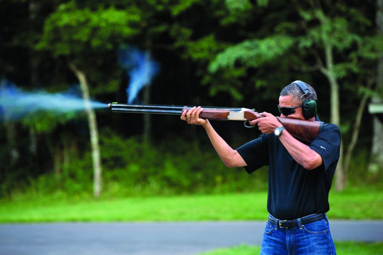 In this photo released by the White House, President Barack Obama shoots clay targets on the range at Camp David, Md., Saturday, Aug. 4, 2012. The White House released a photo of Obama firing a gun, two days before he heads to Minnesota to discuss gun control. In a recent interview with The New Republic magazine, Obama said yes when asked if he has ever fired a gun. He said 