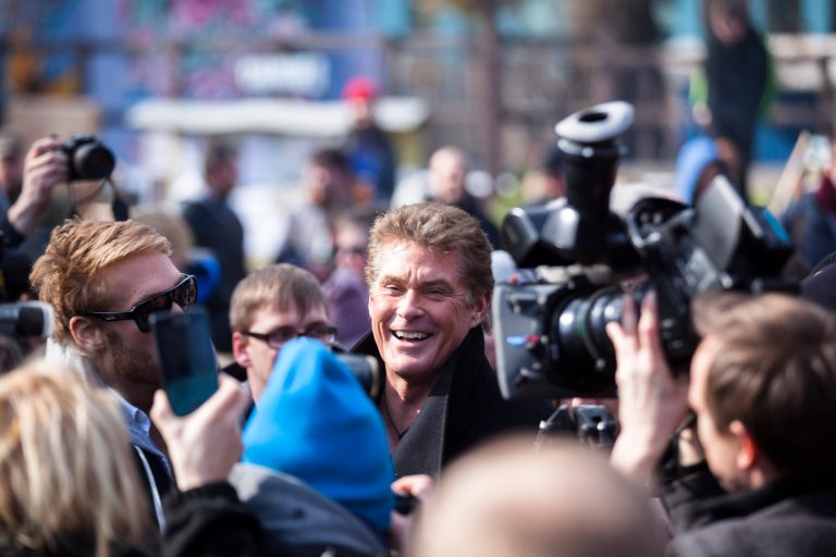 US actor David Hasselhoff, center, arrives for a protest against the removal of a section of the East Side Gallery, a historic part of former Berlin Wall, in Berlin, Sunday, March 17, 2013. Hasselhoff is fondly remembered by many Germans for releasing a song called 