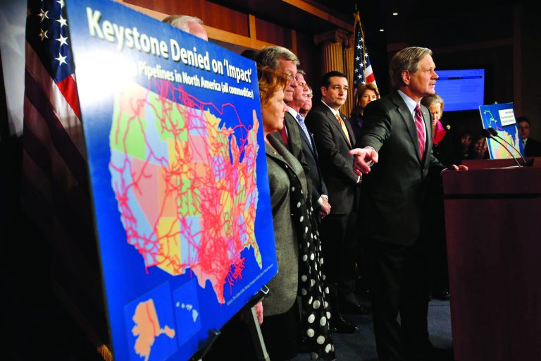 Sen. John Hoeven, R-N.D, points at a illustration of existing pipeline, while speaking at a news conference about the Keystone XL oil pipeline on Capitol Hill in Washington, Wednesday, Jan. 23, 2013. (AP Photo/Jacquelyn Martin)