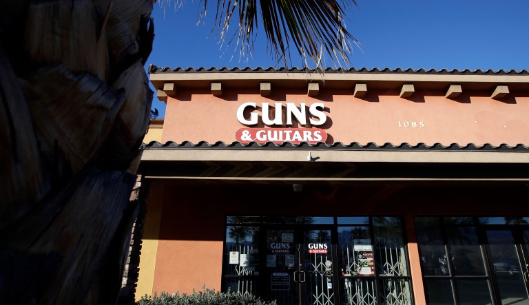 The Guns & Guitars store is shown in Mesquite, Nev., Monday, Oct. 2, 2017. The store's general manager Christopher Sullivan said in a statement Monday that Stephen Craig Paddock showed no signs of being unfit to buy guns. Paddock killed dozens and injured hundreds Sunday night when he opened fired at an outdoor country music festival in Las Vegas. (AP Photo/Chris Carlson)