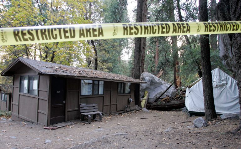   FILE - In this Monday, Oct. 20, 2008 file photo, restriction tape blocks an area at Curry Village in Yosemite National Park, Calif., after a boulder fell during a rock slide. Falling boulders are the single biggest force shaping Yosemite Valley, one of the most popular tourist destinations in the nationâs system of national parks. Now large swaths of popular haunts deemed unsafe are closing as officials acknowledge they knew for more than a decade ago that unsuspecting tourists were being lodged in harmâs way. On Thursday, June 14, 2012, the National Park Service will announce that potential danger from the unstable 3,000-foot-tall slab of granite known as Glacier Point, a picturesque promontory that for decades has provided a dramatic backdrop to park entertainment events, will leave uninhabitable large parts of Yosemite Valleyâs most popular lodging areas. (AP Photo/Paul Sakuma)   
