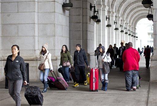 Holiday travelers swarm area highways, airports