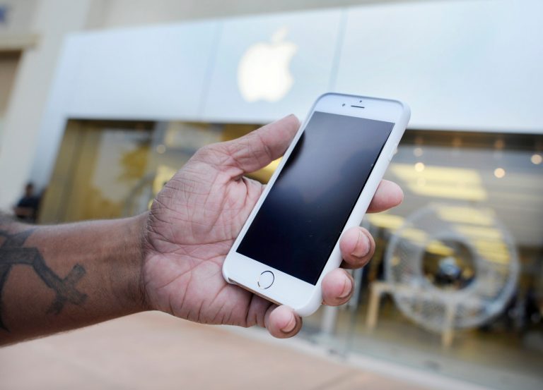 A fake Apple infographic is claiming that users of the newly released iOS 8 mobile operating system can charge their iPhones by cooking them in a microwave. (AP Photo)