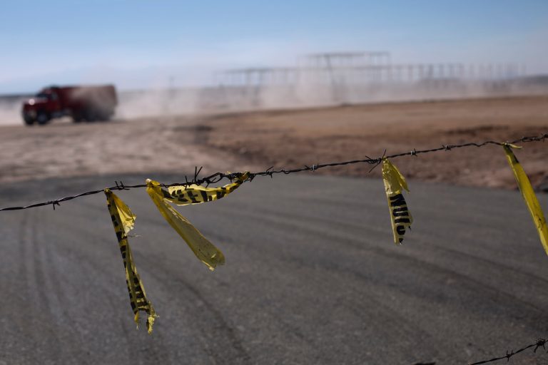 Barbed wire surrounds the site of a cancelled Ford auto manufacturing plant, one day after the U.S. auto company announced the project was called off, in Villa de Reyes, outside San Luis Potosi, Mexico, Wednesday, Jan. 4, 2017. The perception in this region was largely that President-elect Donald Trump, who had promised for months to bring manufacturing jobs back to the U.S. while at the same time disparaging Mexicans, had made good before even settling into the White House. (AP Photo/Rebecca Blackwell)
