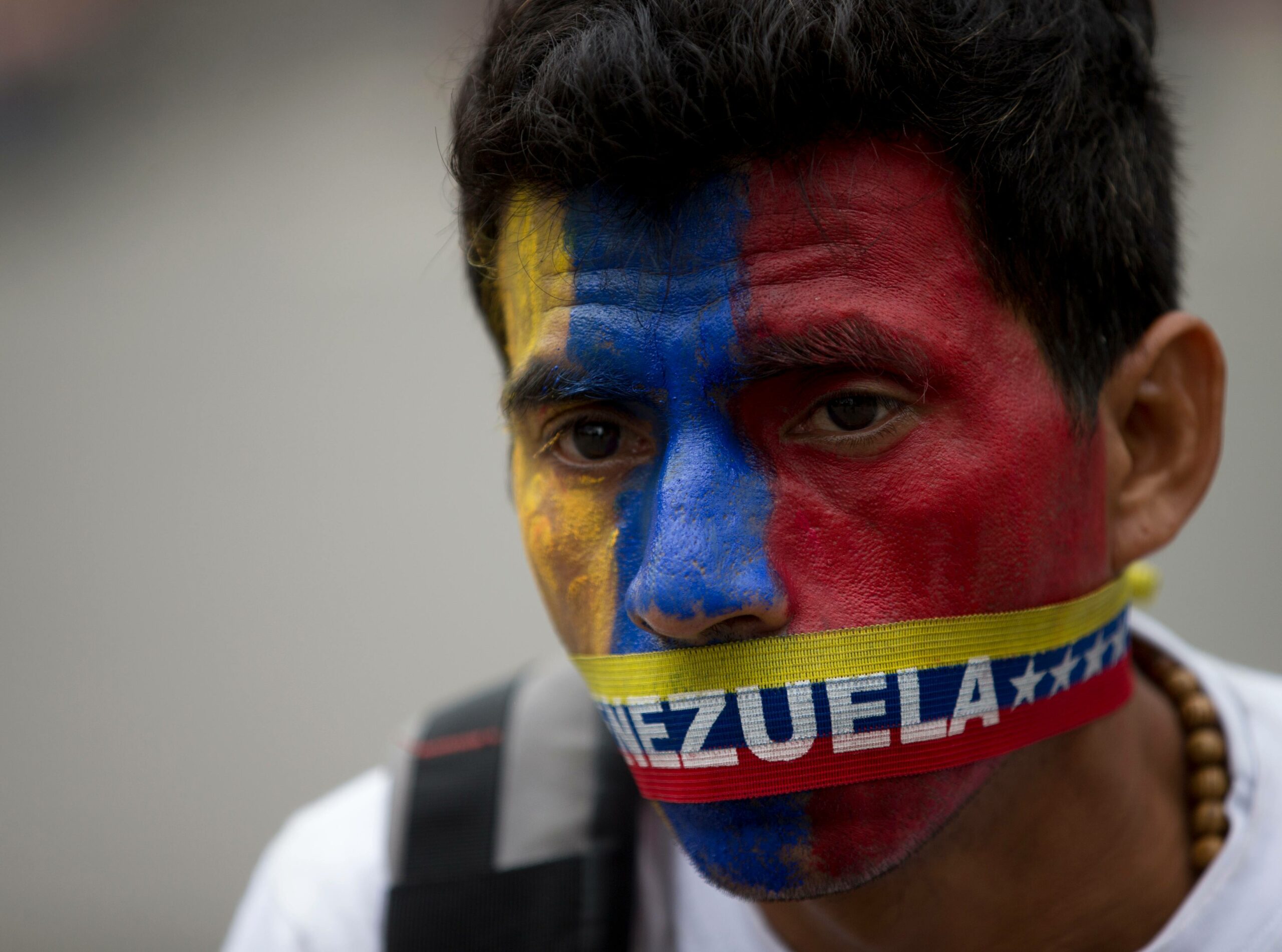 Venezuela sends 11 students to trial, frees others