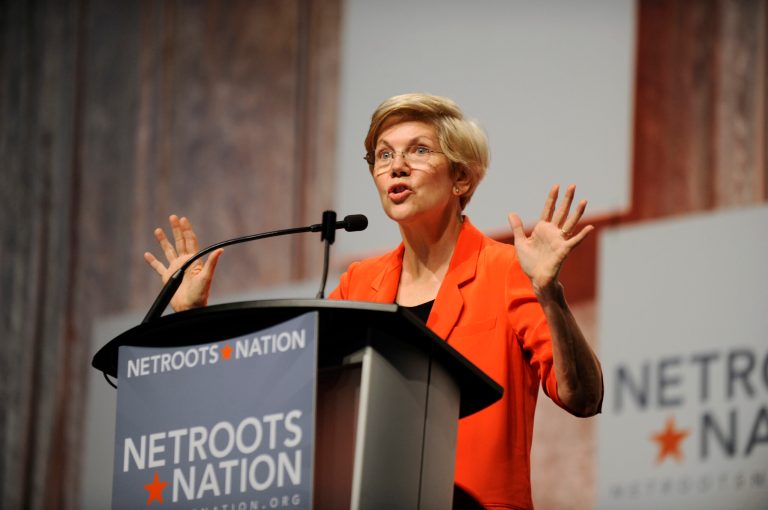 U.S. Sen. Elizabeth Warren, D-Mass., waves to the crowd after her introduction at the Netroots Nation conference in Detroit, Friday. (AP Photo/Detroit News, David Coates)ÃÂ 