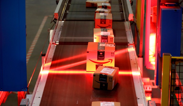 Packages riding on a belt are scanned at the Amazon Fulfillment center in Robbinsville Township, N.J., Tuesday, Aug. 1, 2017. It's rumored that Amazon has plans to move into the prescription drug market. (AP Photo/Julio Cortez)