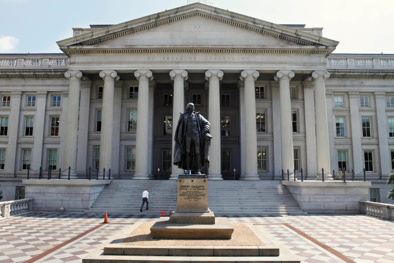 Pictured above, a statue of former Treasury Secretary Albert Gallatin stands outside the Treasury Building in Washington. Total government debt hit a record $19.38 trillion on Thursday, up nearly $98 billion from the day before. 