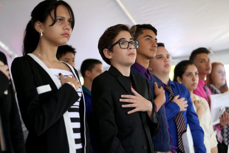 Roughly 150 immigrants, mostly children, are sworn in as U.S. citizens during a naturalization ceremony on February 17, 2015 in Homestead, Florida. (Getty images)