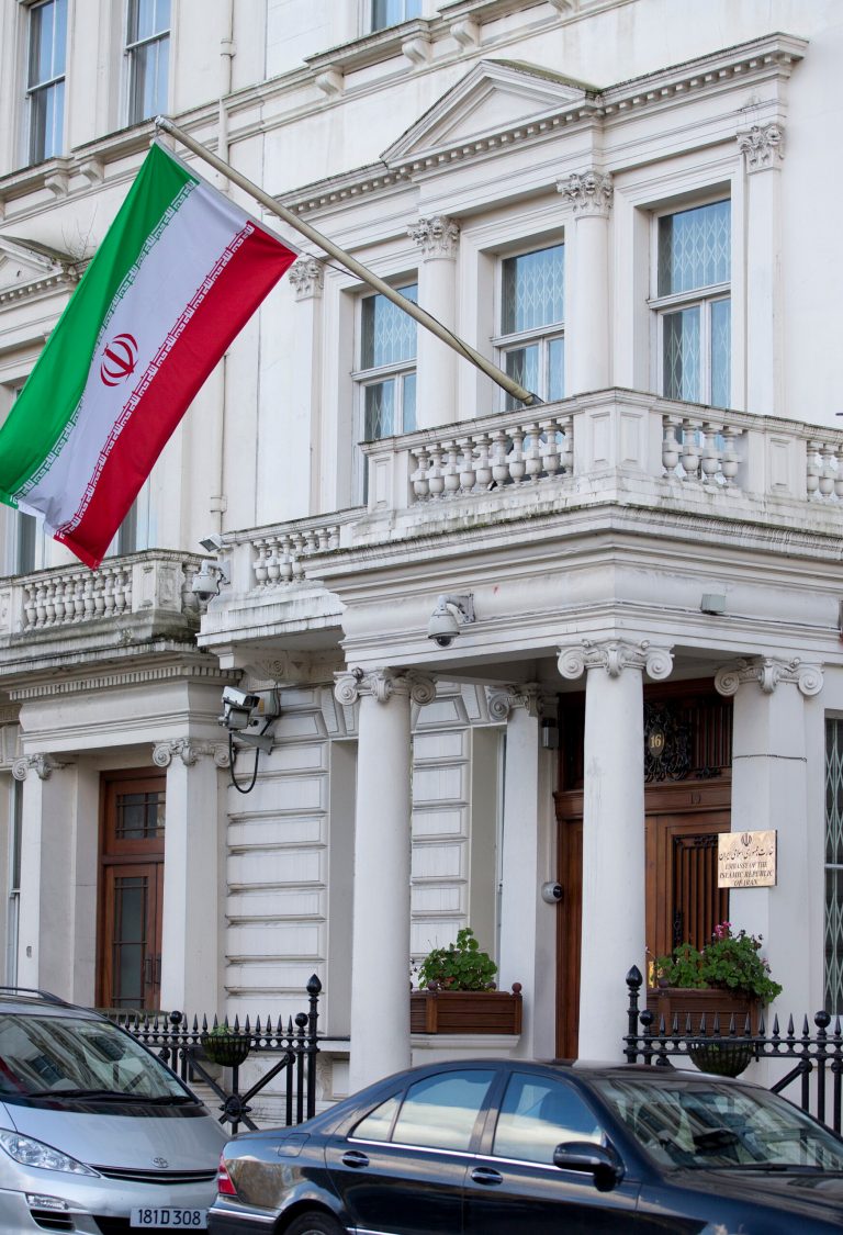 The national flag of the Peoples Islamic Republic of Iran flies outside its embassy in London, Thursday, Feb. 20, 2014. The Iranian Embassy in London reopened its doors Thursday more than two years after it shut  down over diplomatic tensions between the Islamic Republic and the United Kingdom.  (AP Photo/Alastair Grant)