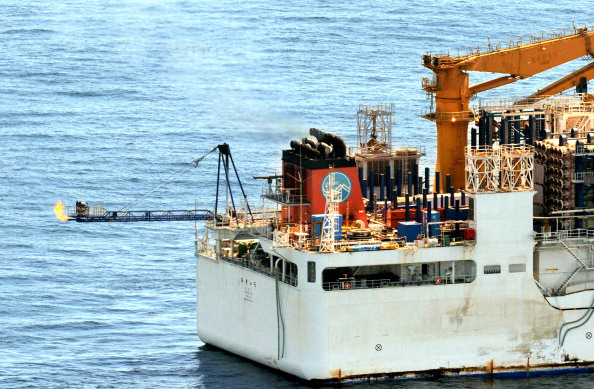 In this aerial image, the first ever methane hydrate gas taken from seabed layers is seen lit at the stern of drilling vessel Chikyu, as Japan Oil, Gas and Metals National Corp. begins the world's first offshore test mining in the off coast of Atsumi Peninsula on March 12, 2013 in Aichi, Japan. (Photo by The Asahi Shimbun via Getty Images)