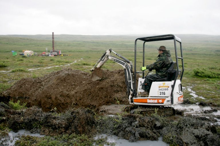A worker with the Pebble Mine project test-drills in the Bristol Bay region of Alaska near the village of Iliamma in July 2007. (AP Photo/Al Grillo,File)