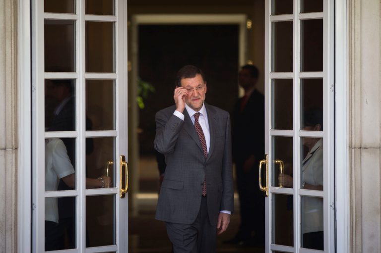   Spain's Prime Minister Mariano Rajoy, adjust his glasses before a meeting with Netherlands' Prime Minister Mark Rutte at the Moncloa Palace, in Madrid, Thursday, June 7, 2012. Spain's Prime Minister appeared Thursday to have abandoned his insistence that the country's troubled banking sector will not need an external bailout, as for the first time he avoided ruling out such an option.(AP Photo/Daniel Ochoa de Olza)  