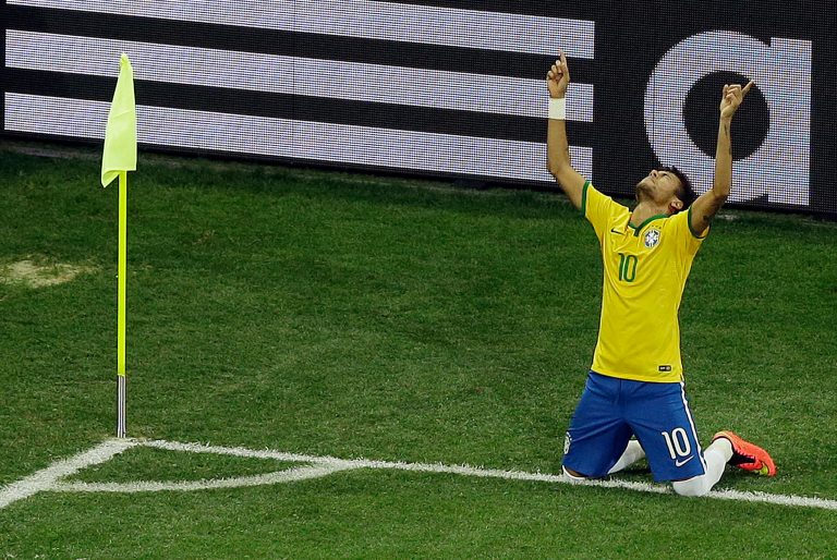 Brazil's Neymar celebrates scoring his side's 2nd goal during the group A World Cup soccer match between Brazil and Croatia, the opening game of the tournament, in the Itaquerao Stadium in Sao Paulo, Brazil, Thursday, June 12, 2014. (AP Photo/Thanassis Stavrakis)