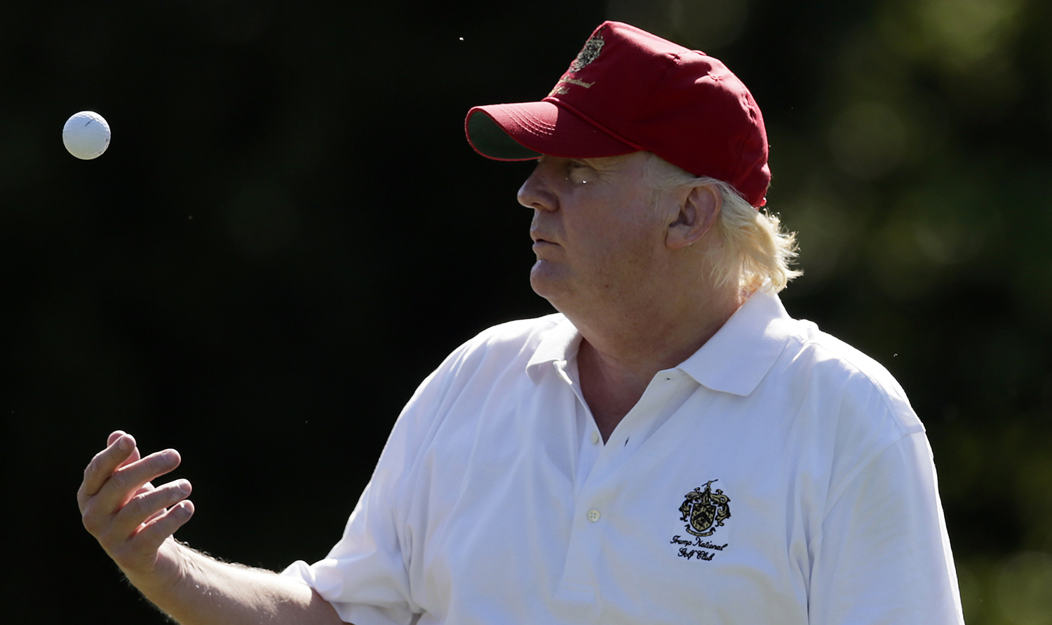 Amid uproar, Trump plays golf