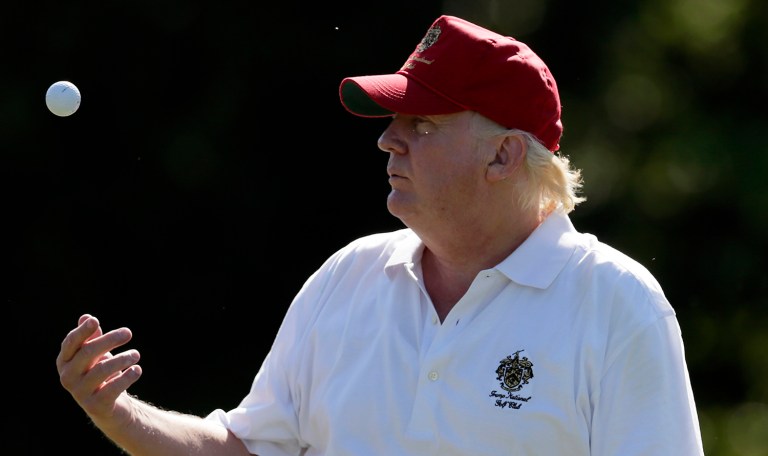 Trump went to play for the second day in a row at the Trump International Golf Club in West Palm Beach, Fla. (AP Photo/Patrick Semansky)