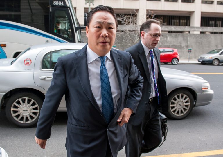 Stephen Kim, a former State Department expert on North Korea, arrives at federal court in Washington, Wednesday, April 2, 2014, where a federal judge sentenced him to 13 months in prison for passing classified information to a journalist.  (AP Photo/Cliff Owen)