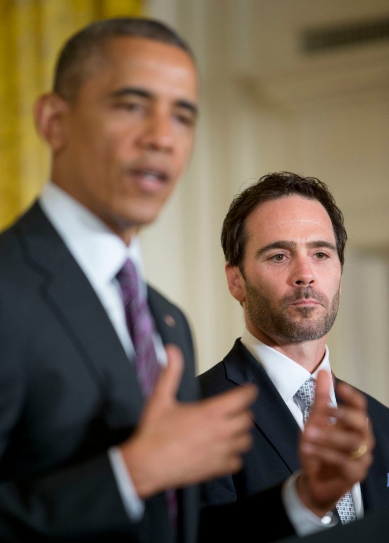 Jimmie Johnson listens as President Barack Obama speaks during a ceremony honoring 2013 NASCAR Sprint Cup Series champions, Wednesday, June 25, 2014, in the East Room of the White House in Washington. (AP Photo/Pablo Martinez Monsivais)