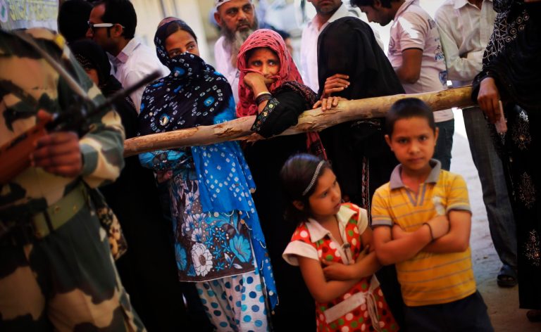 In this April 10, 2014 photo, Indian Muslims wait in a queue to cast their votes in Muzaffarnagar, India, an area that witnessed one of the worst Hindu Muslim riots of recent times in which 69 people were killed and over 40,000 were rendered homeless. Muslims account for more than 13 percent of India's population and face no legal discrimination under the country's secular constitution. But while many Indian Muslims have held high government offices  - the current vice president Hamid Ansari is Muslim - the community is largely poor and fares badly on most socio-economic indicators like health and education. (AP Photo/Altaf Qadri)