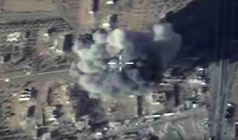 In this photo made from the footage taken from Russian Defense Ministry official web site and provided Wednesday, Dec. 9, 2015 an aerial image shows cruise missile strike on a local ISIS headquarters in Syria. Their rules of engagement are different than for U.S. forces. (Russian Defense Ministry Press Service via AP)