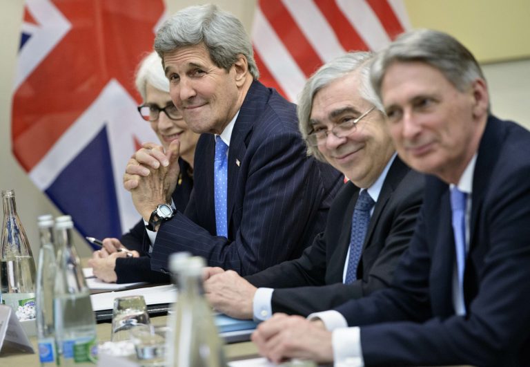 From left, U.S. Under Secretary for Political Affairs Wendy Sherman, U.S. Secretary of State John Kerry, U.S. Secretary of Energy Ernest Moniz and British Foreign Secretary Philip Hammond wait for a meeting at the Beau Rivage Palace Hotelin Lausanne, Switzerland, Sunday March 29, 2015. Iran is considering demands for further cuts to its uranium enrichment program but is pushing back on how long it must limit technology it could use to make atomic arms, Western officials involved in the nuclear talks said Sunday. (AP Photo/Brendan Smialowski)