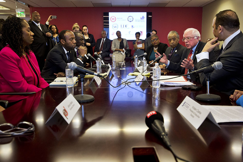Sanders huddles with civil rights leaders