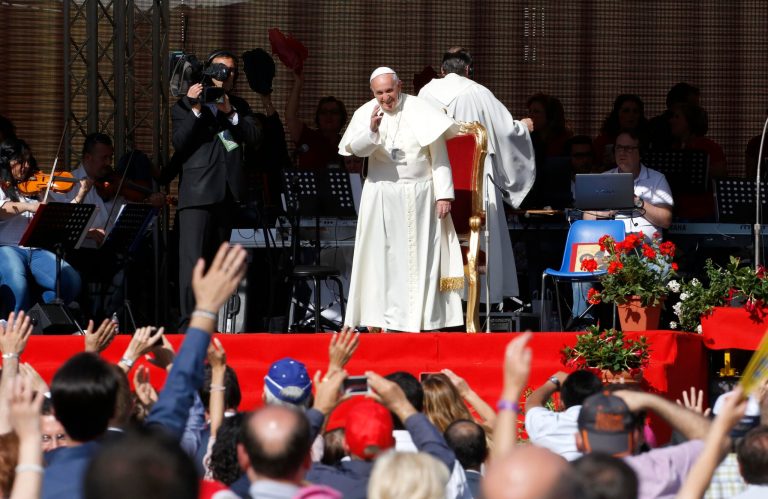 Pope Francis waves to faithful as he arrives for a meeting at Rome's Olympic stadium, Sunday, June 1, 2014. (AP Photo/Riccardo De Luca)