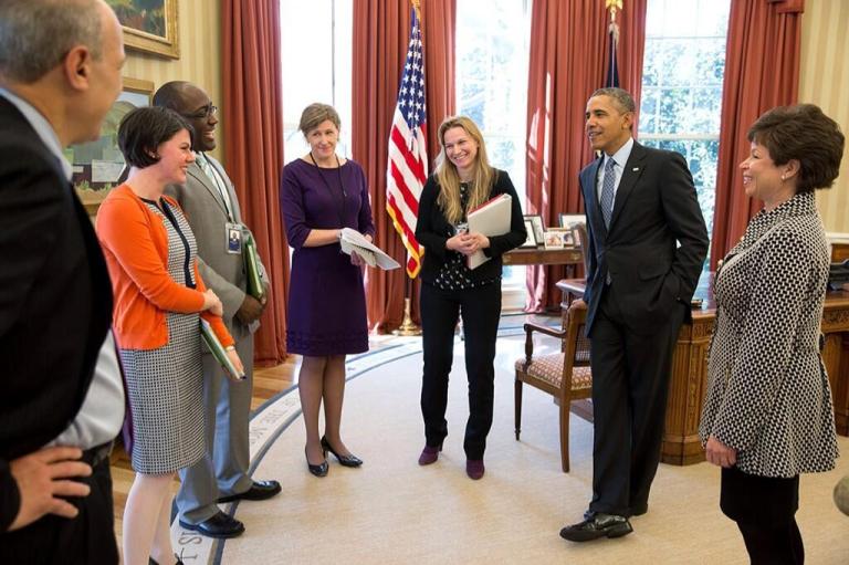 President Obama is informed that the White House met its Affordable Care Act sign-up target. (White House Photo)