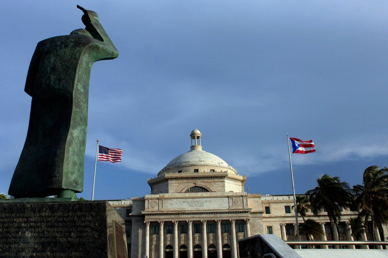 Puerto Rico's debt of $72 billion has required an aggressive restructuring effort from Congress. (AP Photo/Ricardo Arduengo, File)