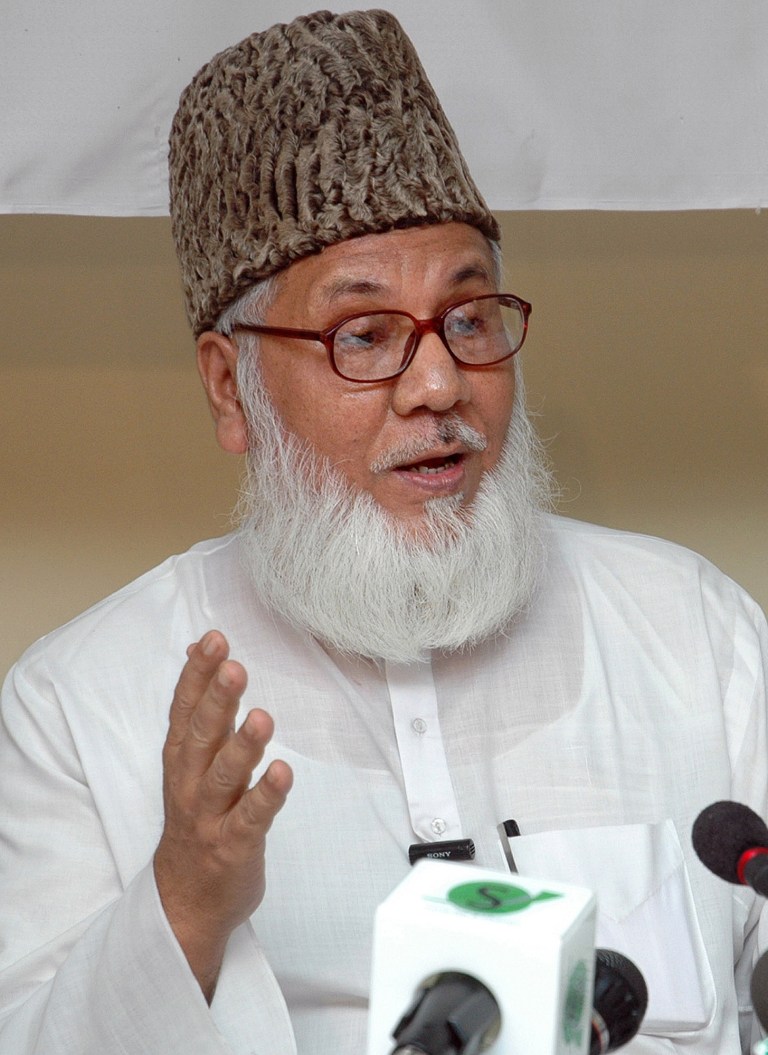 FILE - In this Aug. 20, 2005 file photo, Bangladesh's Jamaat-e-Islami President and Industries Minister Motiur Rahman Nizami addresses the media in Dhaka, Bangladesh. A Bangladesh court Tuesday, June 24, 2014, delayed a verdict against the top leader of the Islamist party charged with war crimes after the defendant in the politically charged trial become ill. A special tribunal was set to deliver the verdict for Nizami, who faces 16 charges, including genocide, murder, torture, rape and destruction of property during the nation's independence war against Pakistan in 1971. (AP Photo/Pavel Rahman, File)